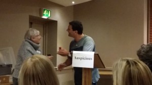 Shelagh receiving best Table Topics ribbon